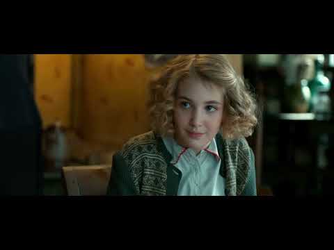Trailer frame: crowded town square at night in The Book Thief