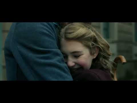 Trailer frame: book burning square with crowds and banners in The Book Thief