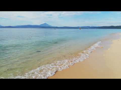 White sandy beach, cotton candy sky and turquoise water