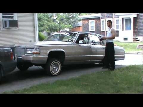 Gold cadillac brougham 3 wheel motion