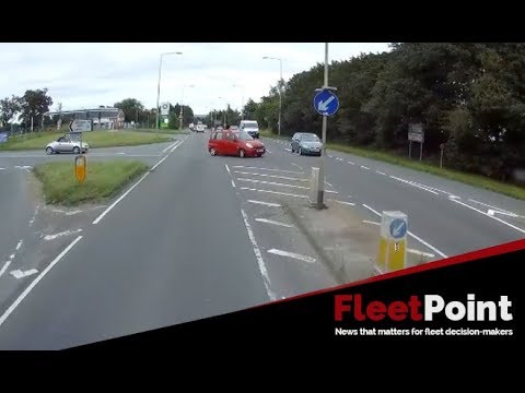 Driver pulls out on a fully loaded HGV