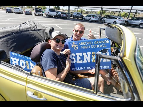 Arroyo Grande High parents and volunteers hand out signs for graduating seniors