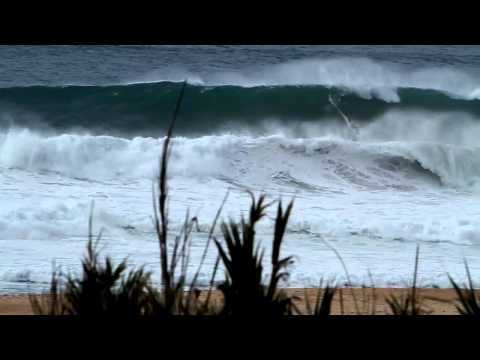 Kelly Slater and Joel Parkinson surfing big waves in Praia do Norte Nazare