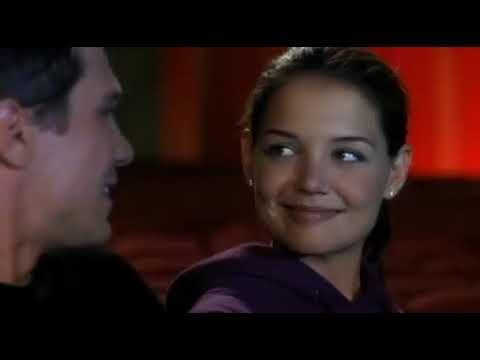 Trailer still: close-up of Samantha and James mid-dance under chandeliers