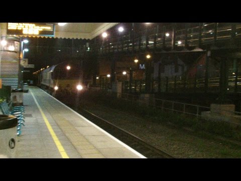 Prestatyn 7.12.2015 - DBS 66207 on track laying train passing Prestatyn