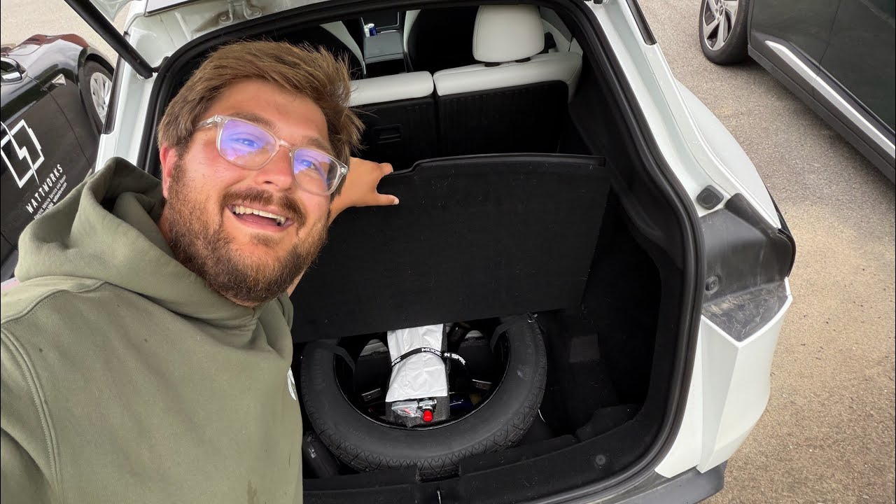 Tesla Model Y rear underfloor storage area with a compact spare tire kit