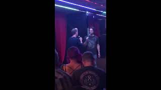 Chris D’Elia and Bryan Callen roasting each other on stage.