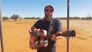 Matt Vend performs Harmonica Man on the side of the road somewhere in the desert in Namibia.