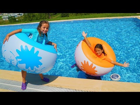Masal and friends played in the pool with inflatable balls - funny kids video