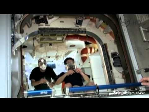 Astronauts float inside SpaceX Dragon capsule