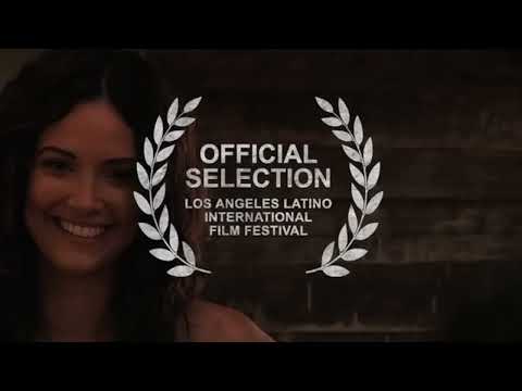 Trailer frame: procession drums and accordion imply perico ripiao and salve textures over action cuts