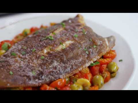 Pan-fried lemon sole with tomato, olive and caper sauce