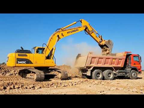 Cat 385C Excavator Loading Cat 775E Dumpers With Blasted Materials