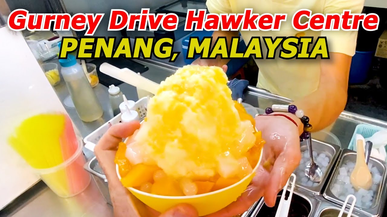 A duo embarks on a culinary adventure at the bustling Gurney Drive Hawker Centre.