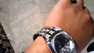white gold watch with diamonds and pinky ring