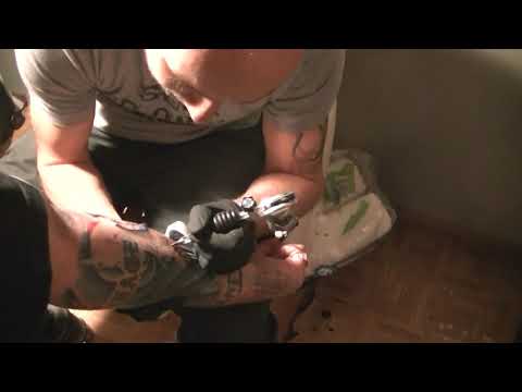 Tattoo artist drops the hottest 16 bars while working . fire