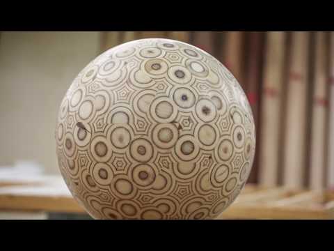 Guy makes a big ball out of plywood