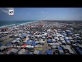 Tents crowd Mediterranean shore of Deir al-Balah as more Palestinian displaced arrive - Video