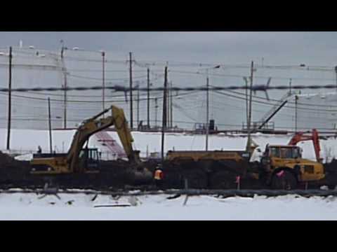 Caterpillar 345C L excavator loading ADT