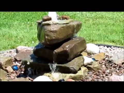 Natural stone lighted fountain 1250 gph with atlantic pondle...