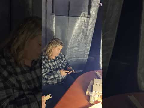 Manda putting in eyelets for bee hive frames