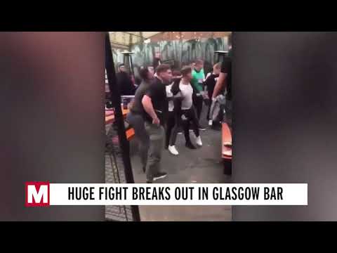 Shocking moment huge brawl erupts at beer garden with drinks and ice buckets thrown
