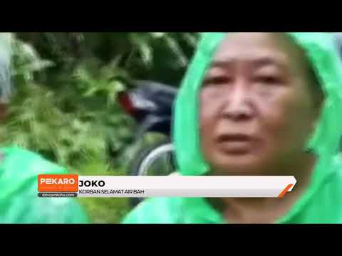 Pasutri Terseret Air Bah