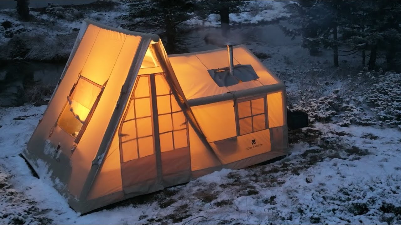 COZY TENT CAMP WITH STOVE IN A SNOWSTORM