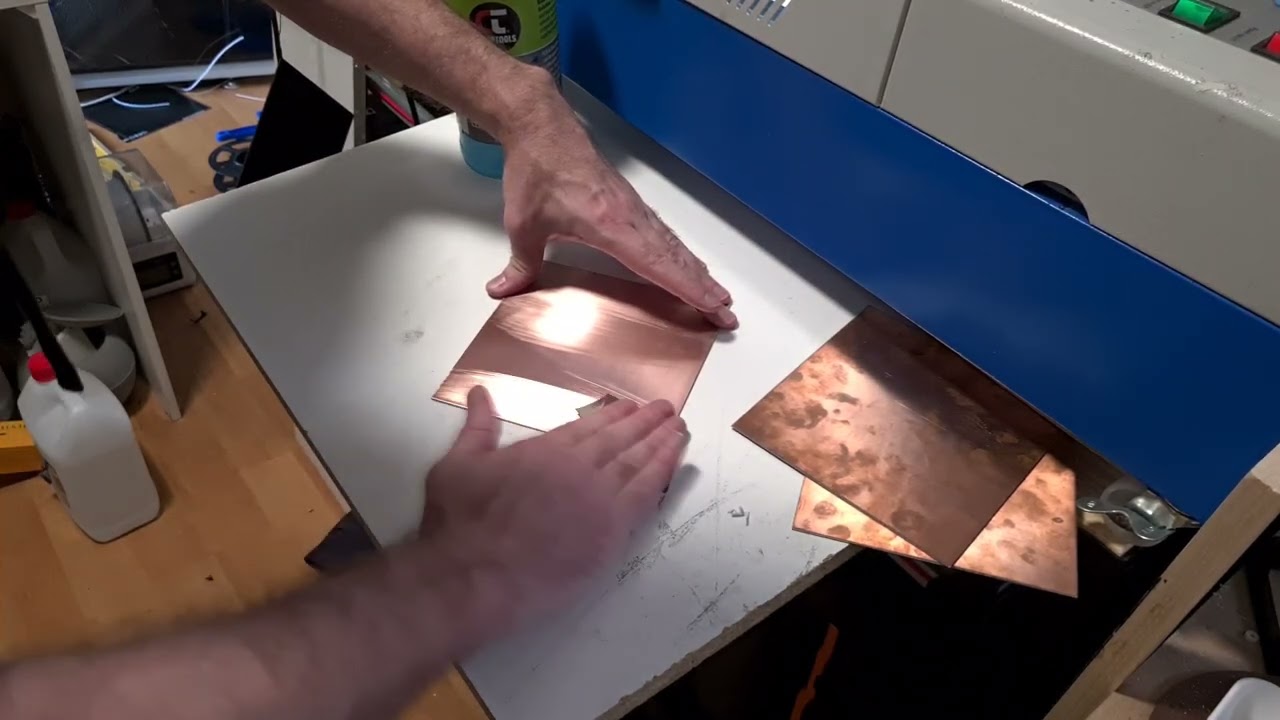 Preparing a PCB for laser engraving.