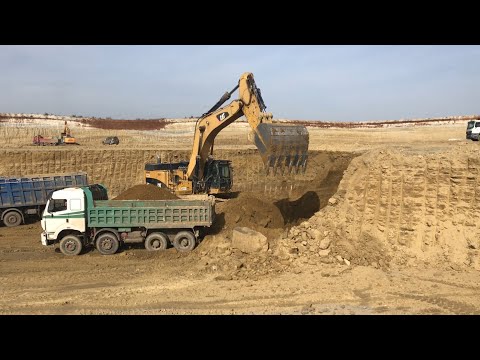Caterpillar 374D Excavator Loading Trucks With Three Passes