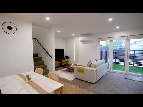 A key hanging on a miniature house model