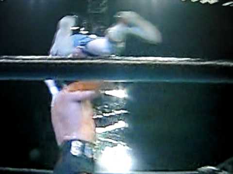Mike Awesome puts Spike Dudley through a table again