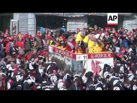 Italy carnival revellers do battle with oranges