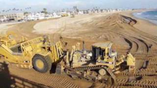 D8R push loading 637E’s at the beach (top view)