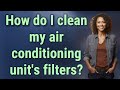 How do I clean my air conditioning unit's filters?