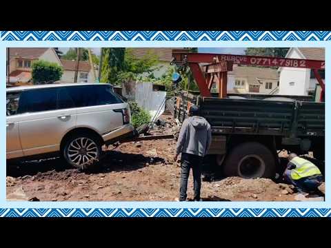 A car is towed after getting stuck near Visa Oshwal Primary School in Parklands