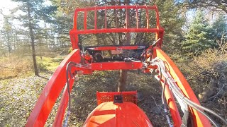 Can my Kioti DK5320se push over trees? If so, should I?