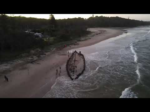 The Buster shipwreck, beached 1893 Woolgoolga, NSW, (Flying over Australia) 4k Drone footage
