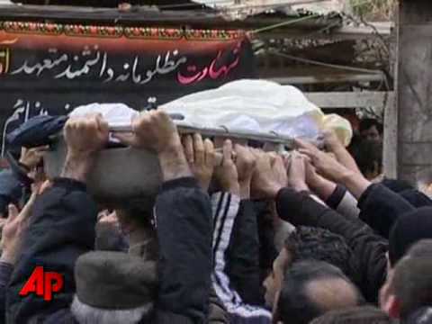 Iranian Mourners, Opposition Bury Slain Physicist