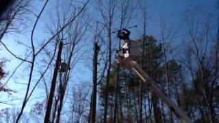 NNEC lineman splicing line to a new pole.