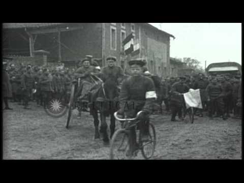 Allied soldiers, officers and medics talk and ride bicycle and horse-carts in Eur...HD Stock Footage