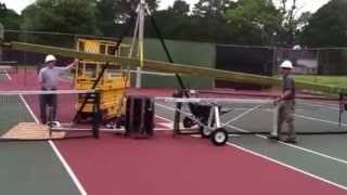 Pole Dancer and Escort on a Tennis Court