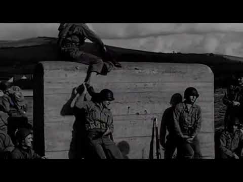 GIs on a beach assault training course somewhere in the UK before D Day