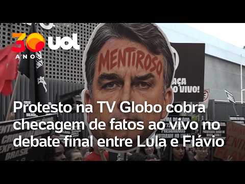 Manifestantes pedem checagem de fatos ao vivo no debate na Globo entre Lula e Flávio Bolsonaro