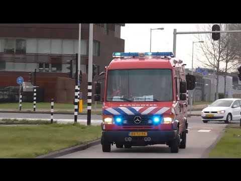 Duikwagen Brandweer Amstelveen 13=5111 met spoed naar een Persoon te water in Amsterdam