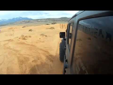 Jeep jumping a sand dune and busting up suspension real bad