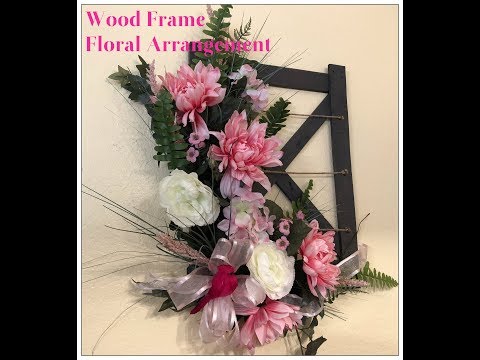 Part of a video titled Tricia's Creations: Floral Wall Decor: Wood Frame Floral Arrangement