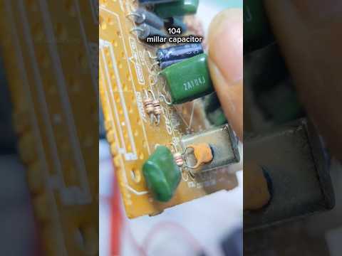 Mylar capacitors with codes on the body, one, zero, four #value #mylar #capacitor #education