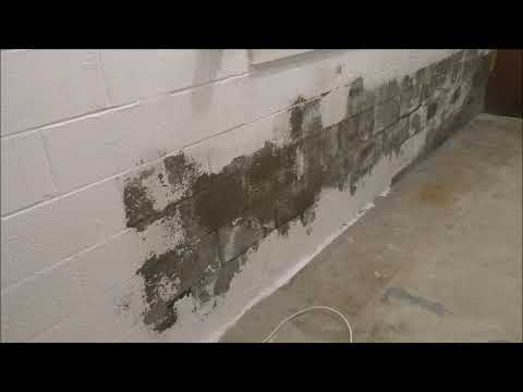 TRYING TO REMOVE THE MOISTURE OUT OF THE CINDER BLOCK...