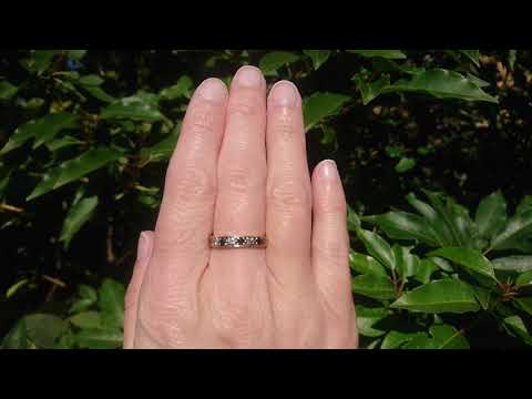 A 9 carat gold sapphire and diamond eternity ring
